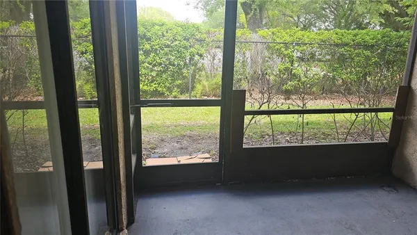 a view of an empty room and a window