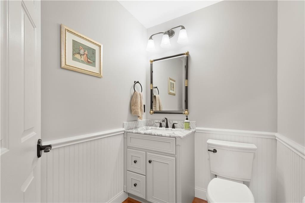 357 McMurray Road Pittsburgh, PA 15241 - Photo 11 of 46 a bathroom with a toilet sink vanity and mirror