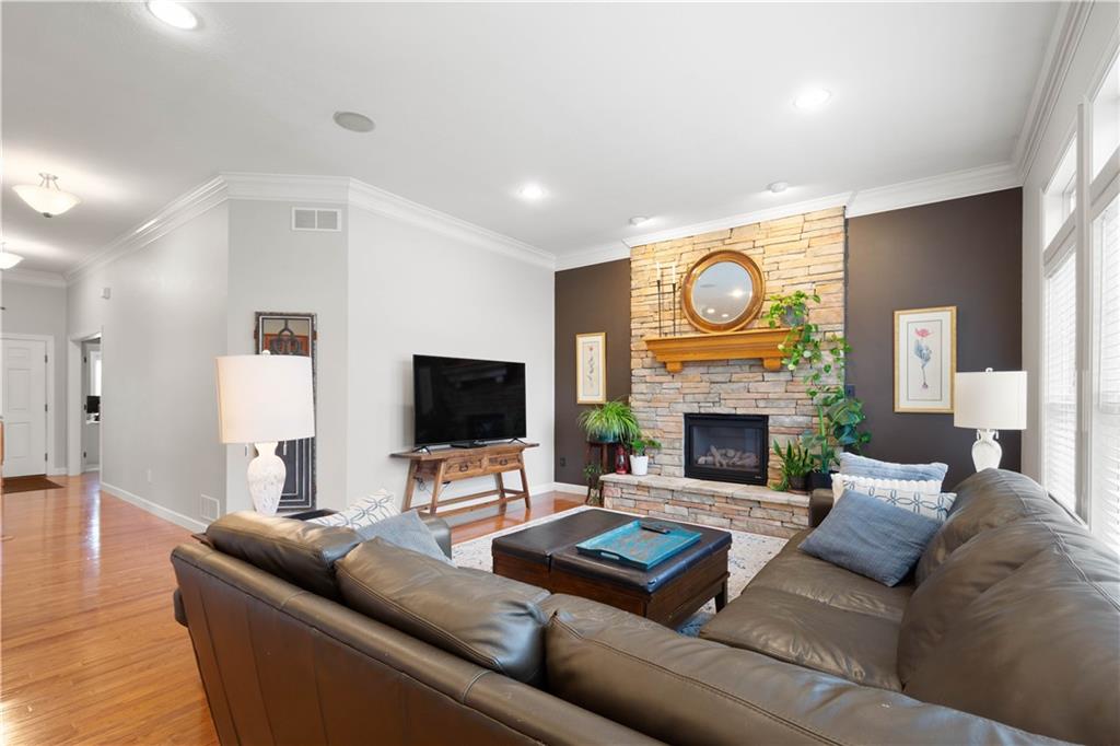 357 McMurray Road Pittsburgh, PA 15241 - Photo 13 of 46 a living room with furniture a fireplace and a flat screen tv