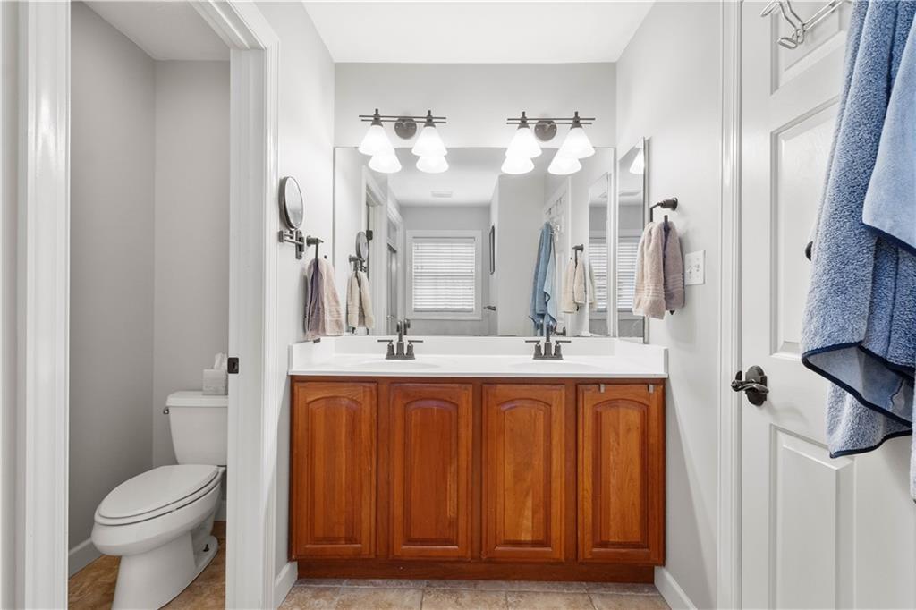 357 McMurray Road Pittsburgh, PA 15241 - Photo 22 of 46 a bathroom with a double vanity sink mirror and toilet