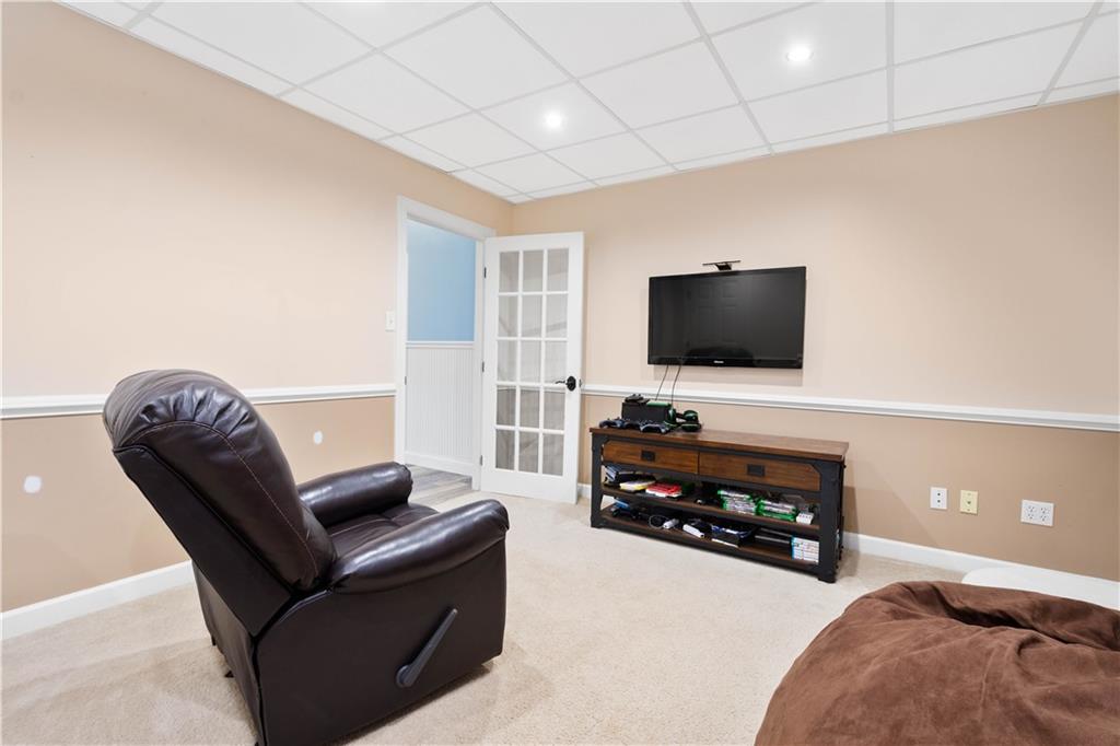 357 McMurray Road Pittsburgh, PA 15241 - Photo 28 of 46 a living room with furniture and a flat screen tv