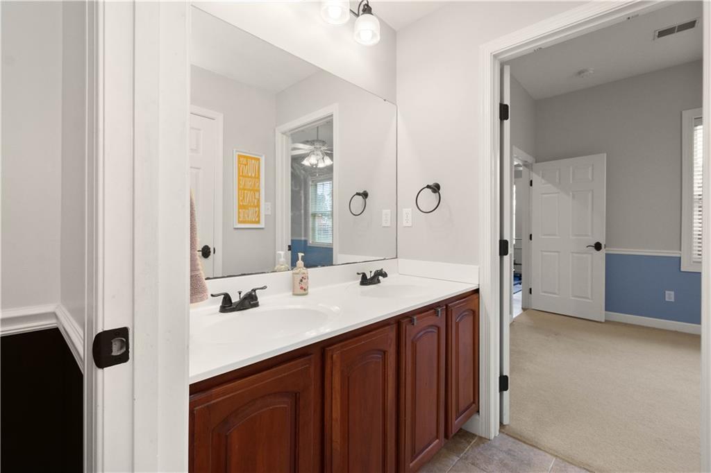 357 McMurray Road Pittsburgh, PA 15241 - Photo 32 of 46 a bathroom with a sink a mirror and a shower