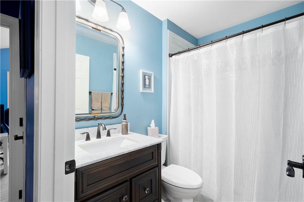 357 McMurray Road Pittsburgh, PA 15241 - Photo 9 of 46 a bathroom with a sink a toilet and a mirror