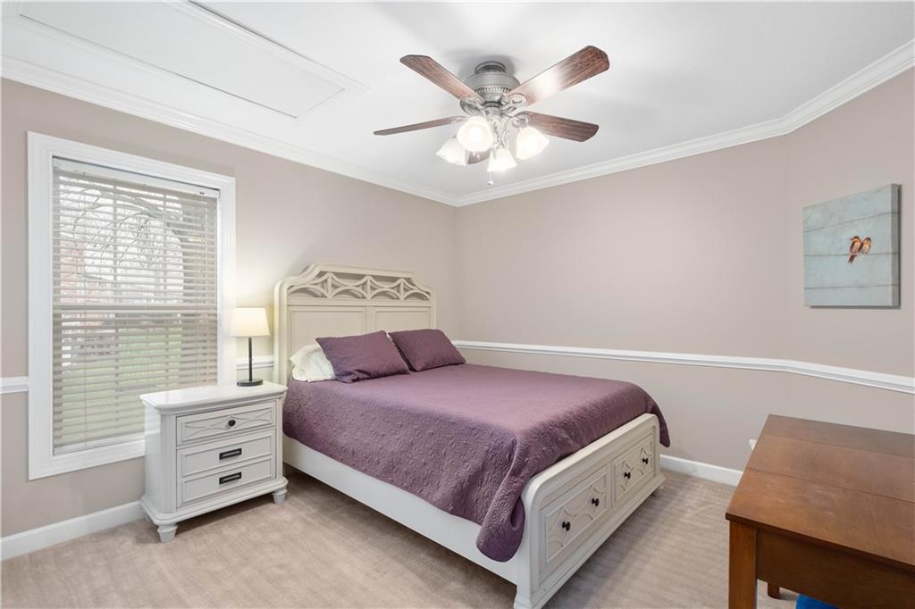 357 McMurray Road Pittsburgh, PA 15241 - Photo 10 of 46 a bedroom with a bed and a chandelier