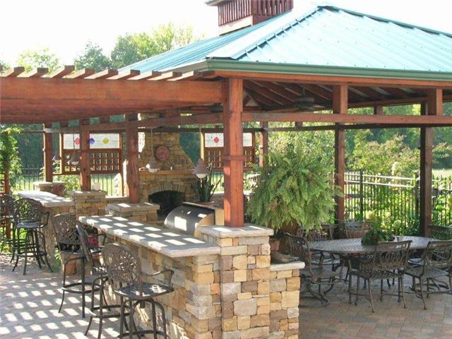 9800 Sims Road Christiana, TN 37037 - Photo 14 of 16 Ok, now how do you get rid of the family and friends with this setup. Fireplace, gourmet kitchen appliances,outdoor lighting and sound system just to name a few amenities.