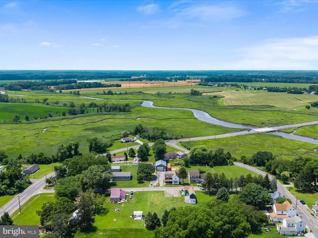 an aerial view of a city with lots of residential buildings and green space