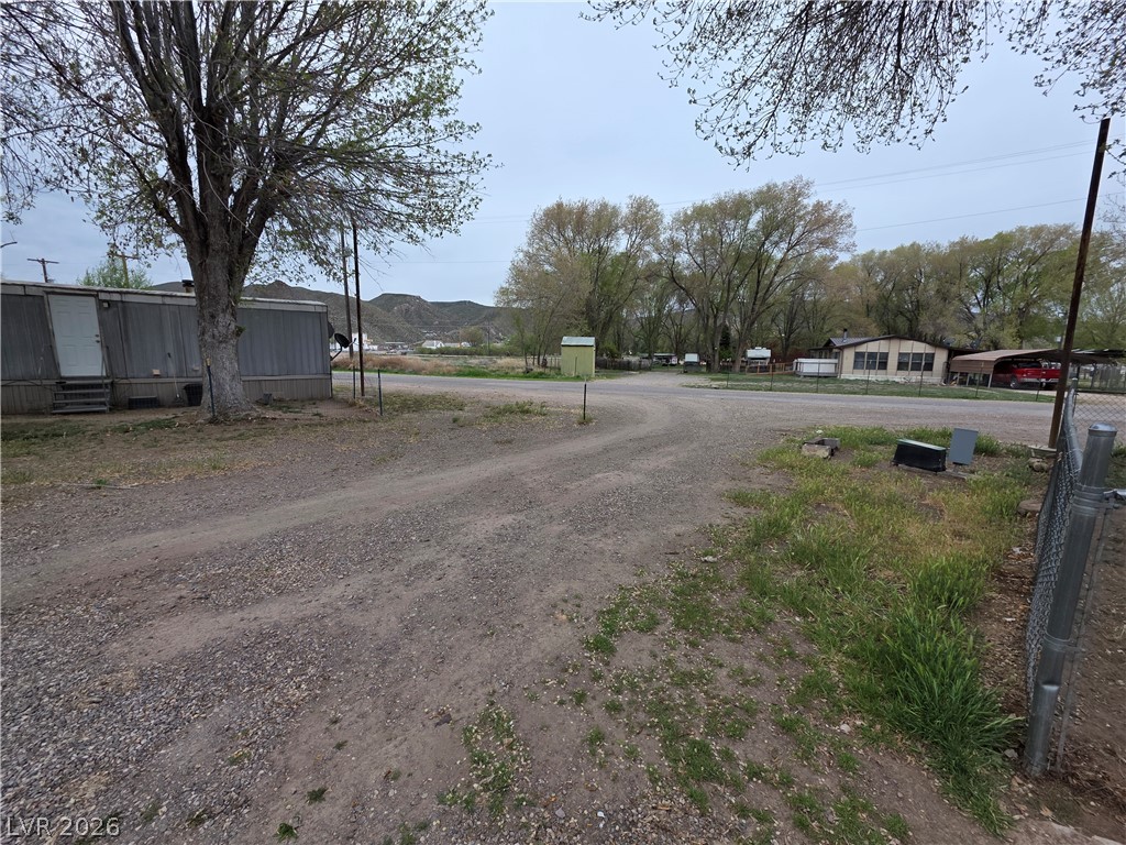 101 Ada Street, Unit 12 Caliente, NV 89008 - Photo 6 of 14 A long gravel driveway provides ample space for vehicles and direct access to this property.