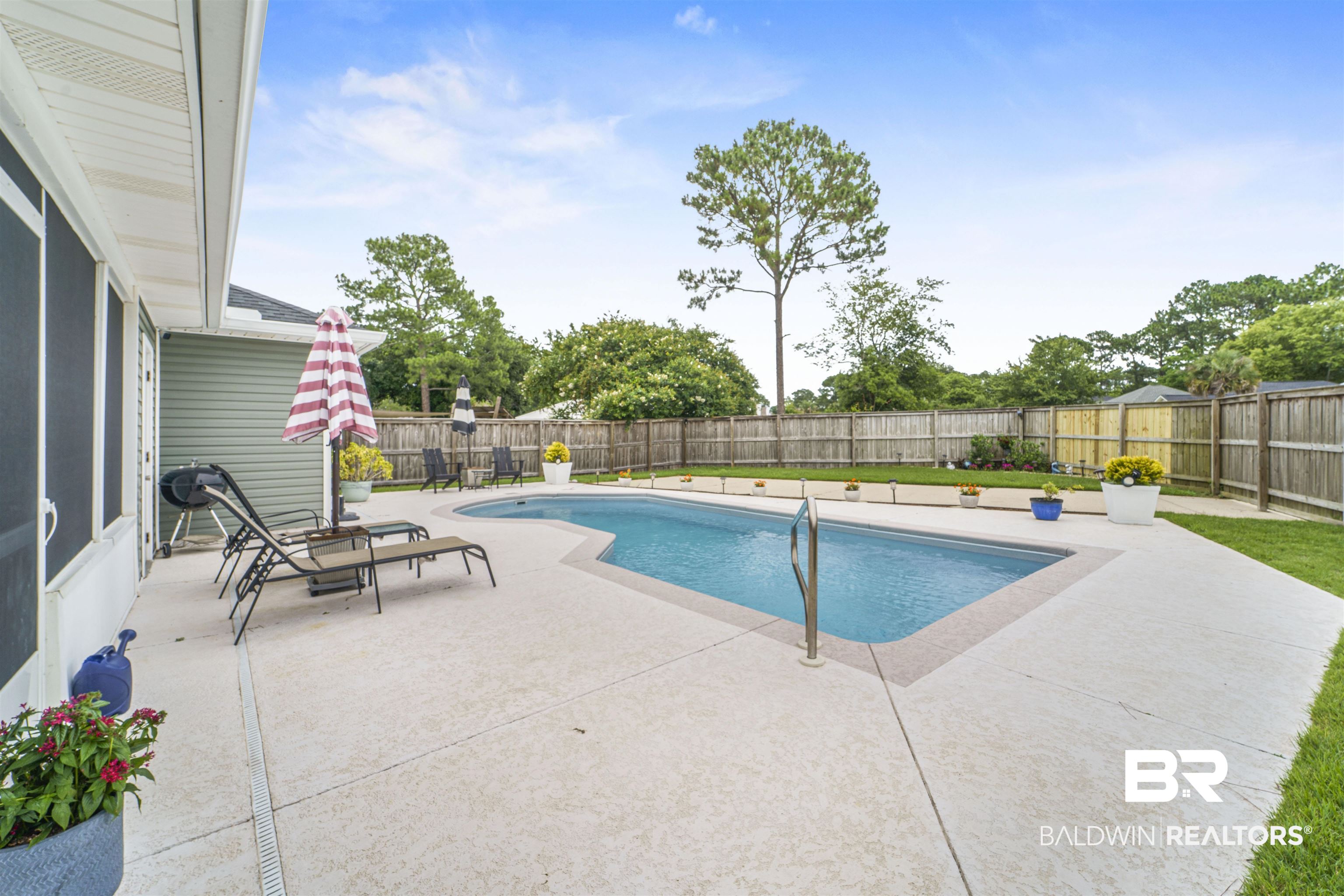 4620 Pine Boulevard Orange Beach, AL 36561 - Photo 30 of 49 View of swimming pool with a patio and a fenced backyard
