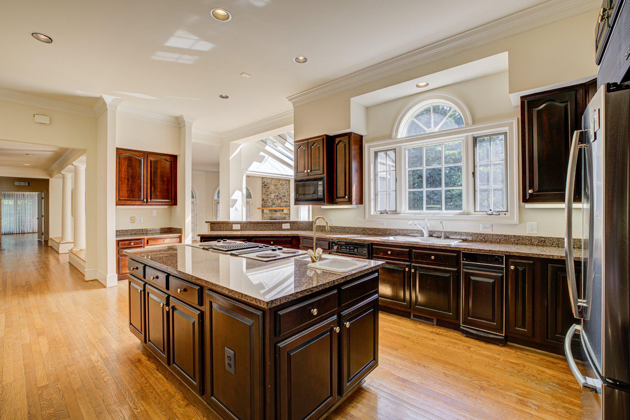 731 Utterback Store Road Great Falls, VA 22066 - Photo 3 of 19 Chefs' kitchen with rich cabinetry.