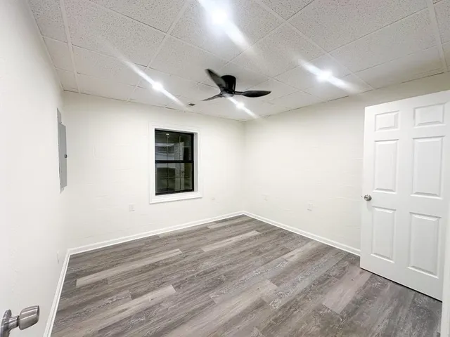 a view of an empty room with a window