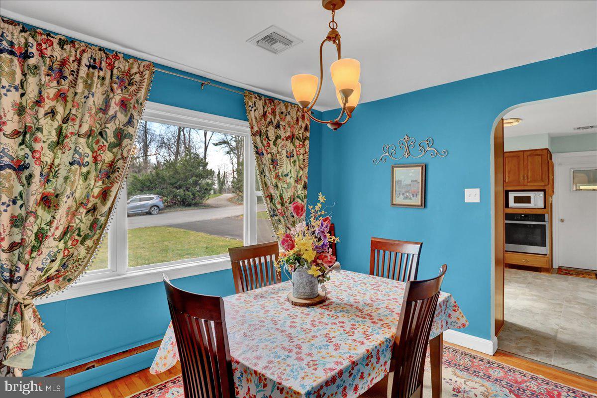 367 Waters Road York, PA 17403 - Photo 9 of 31 a view of a dining room with furniture window and wooden floor