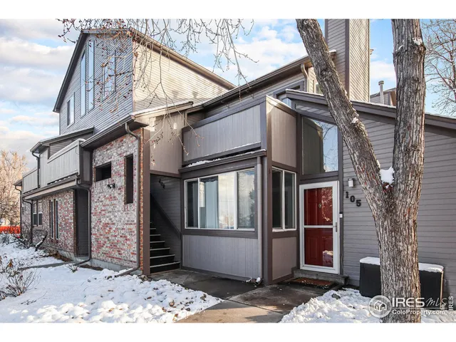 a view of a street with big house