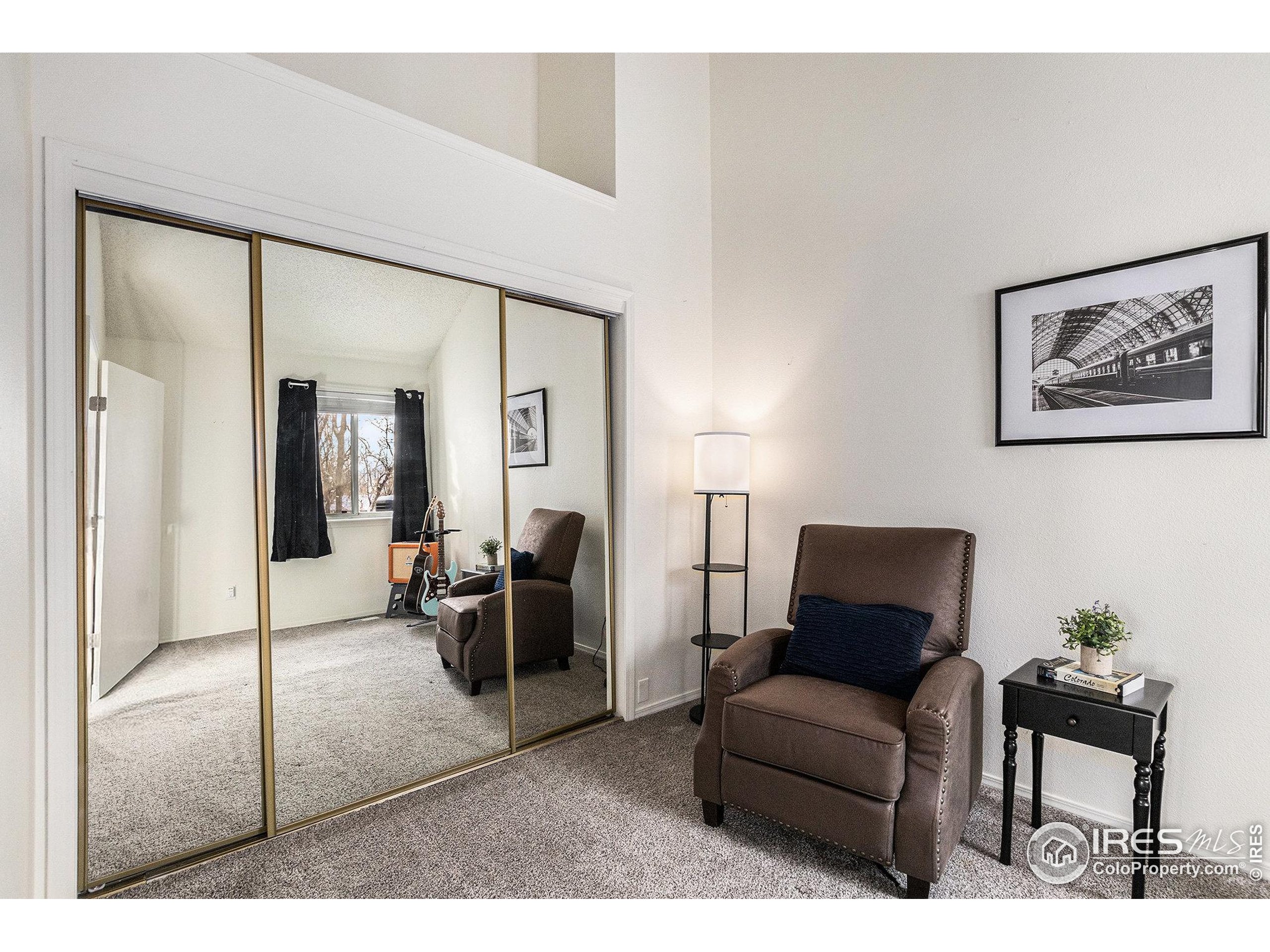 4911 Garrison Street, Unit 206G Wheat Ridge, CO 80033 - Photo 9 of 20 a living room with furniture and a potted plant