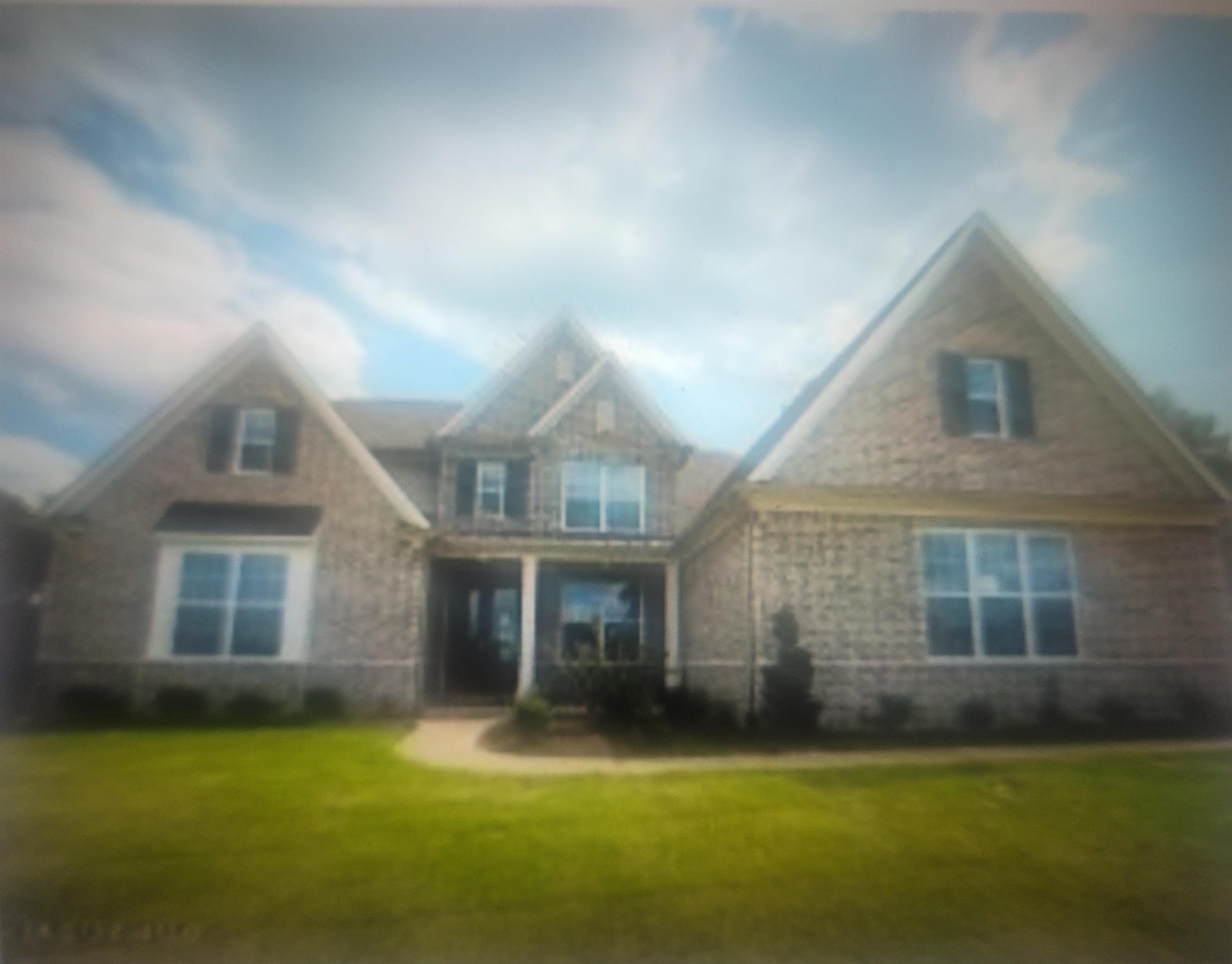 9533 McElroy Road Olive Branch, MS 38654 - Photo 1 of 1 View of front of house with a front yard