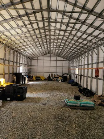 a view of a backyard with sitting area