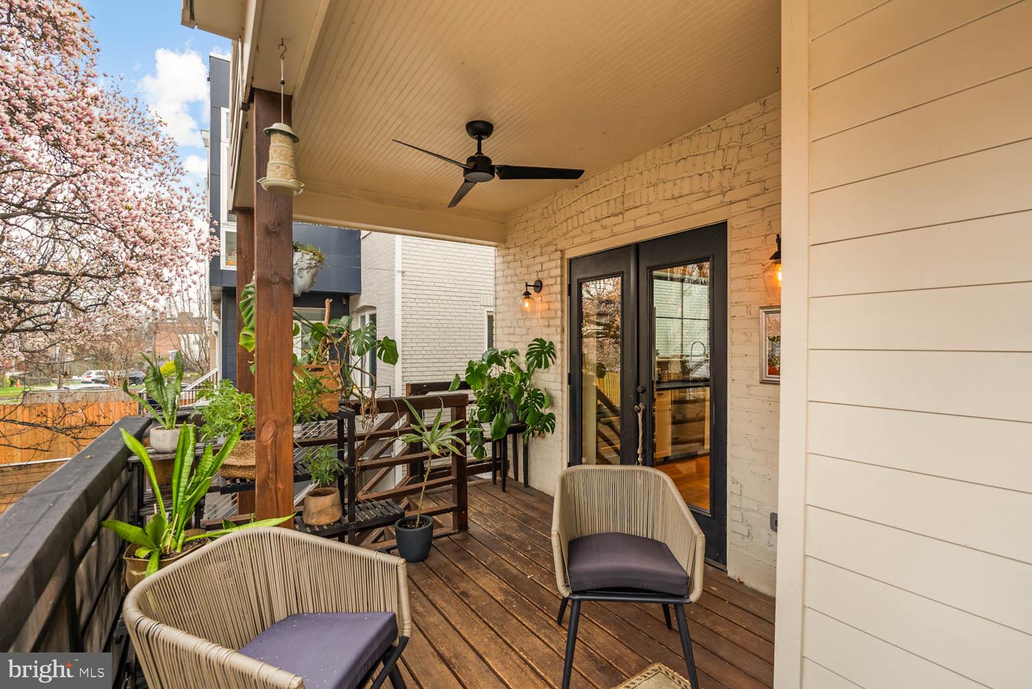 5711 Colorado Avenue Northwest Washington, DC 20011 - Photo 12 of 44 a balcony with furniture and potted plants