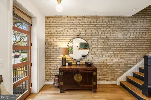 a spacious bedroom with a large bed and a large window