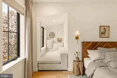 a bathroom with a double vanity sink toilet and shower