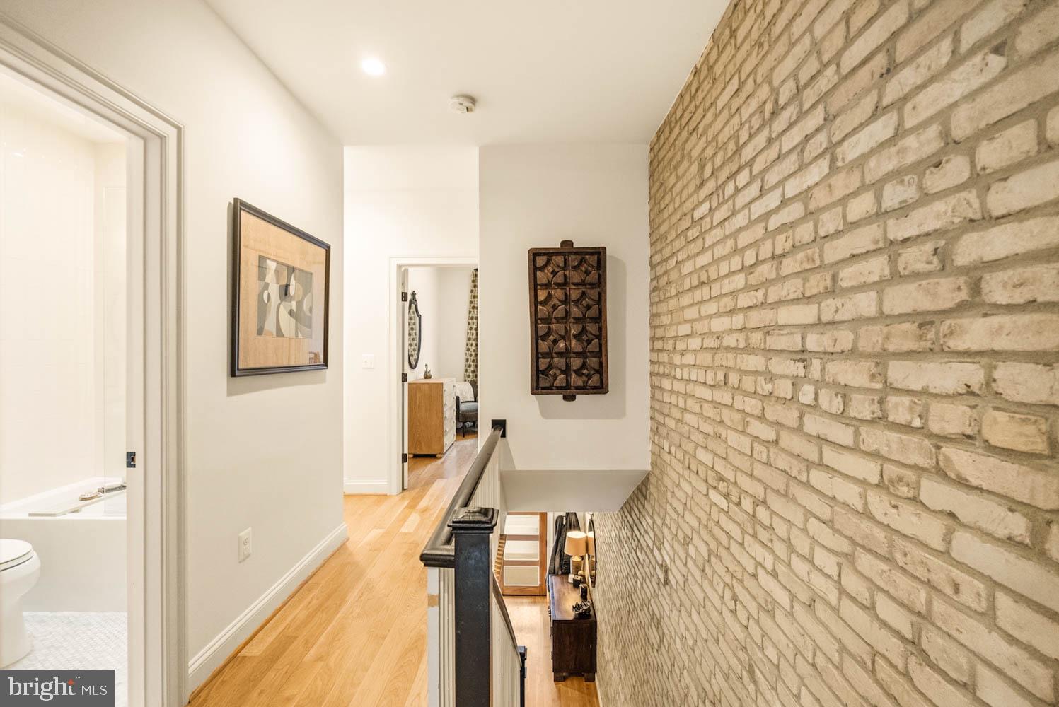 5711 Colorado Avenue Northwest Washington, DC 20011 - Photo 21 of 44 a view of a hallway with paintings on the wall