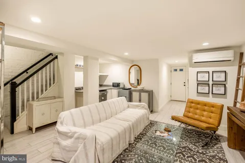 a kitchen with a sink a stove and a wooden floors