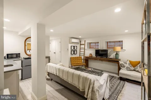 a bathroom with a sink toilet and mirror