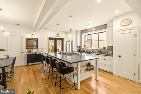 a kitchen with a stove a sink and a refrigerator