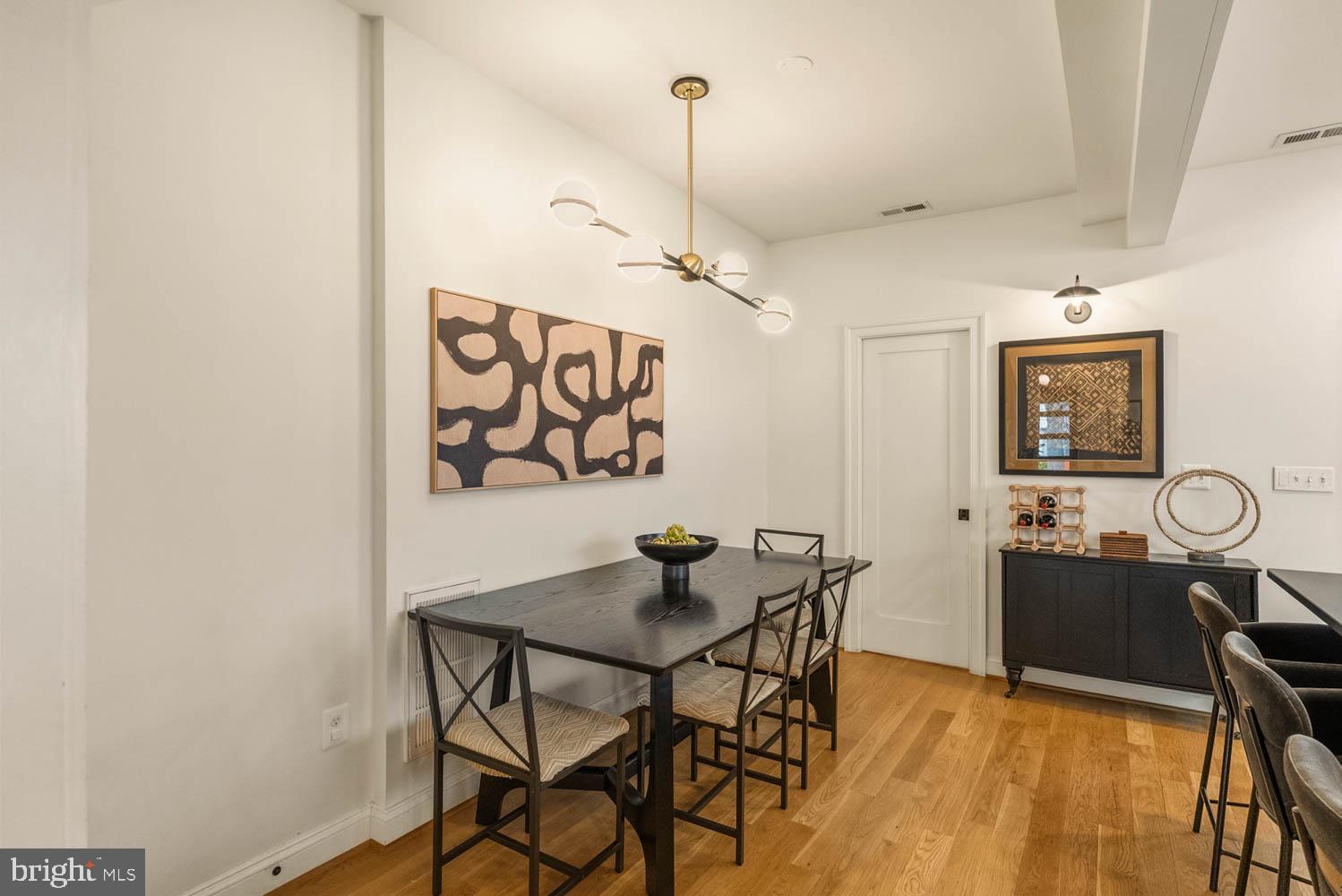5711 Colorado Avenue Northwest Washington, DC 20011 - Photo 9 of 44 a view of a dining room with furniture and wooden floor