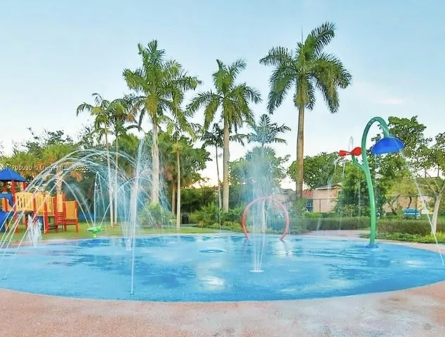 a view of a yard with palm trees
