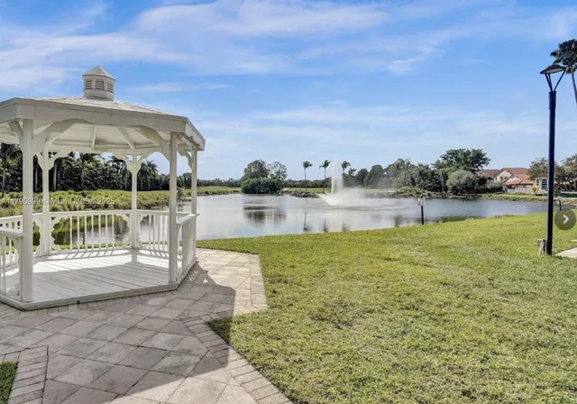 a view of a lake with a garden