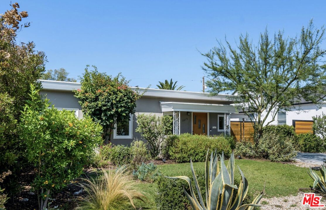 1215 North Avon Street Burbank, CA 91505 - Photo 1 of 37 a front view of a house with a yard