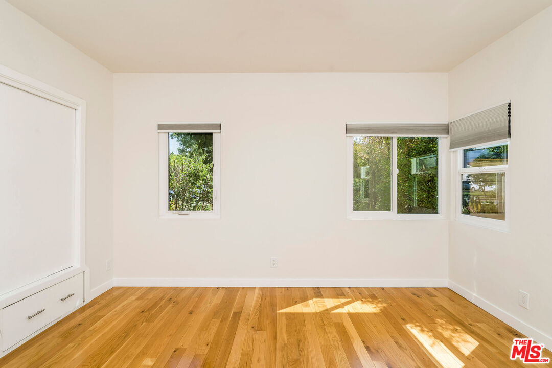 1215 North Avon Street Burbank, CA 91505 - Photo 13 of 37 a view of a room with wooden floor and a window