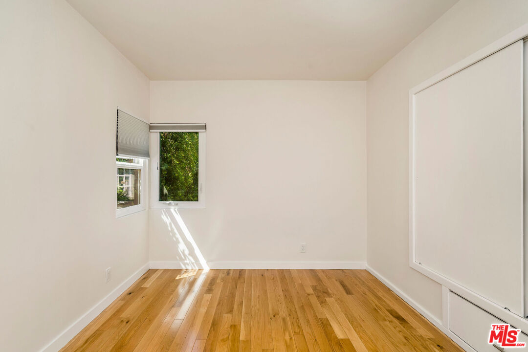 1215 North Avon Street Burbank, CA 91505 - Photo 16 of 37 a view of an empty room with wooden floor