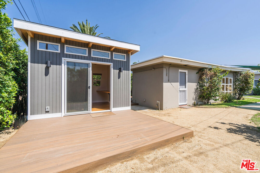 1215 North Avon Street Burbank, CA 91505 - Photo 28 of 37 a view of house with backyard and glass windows