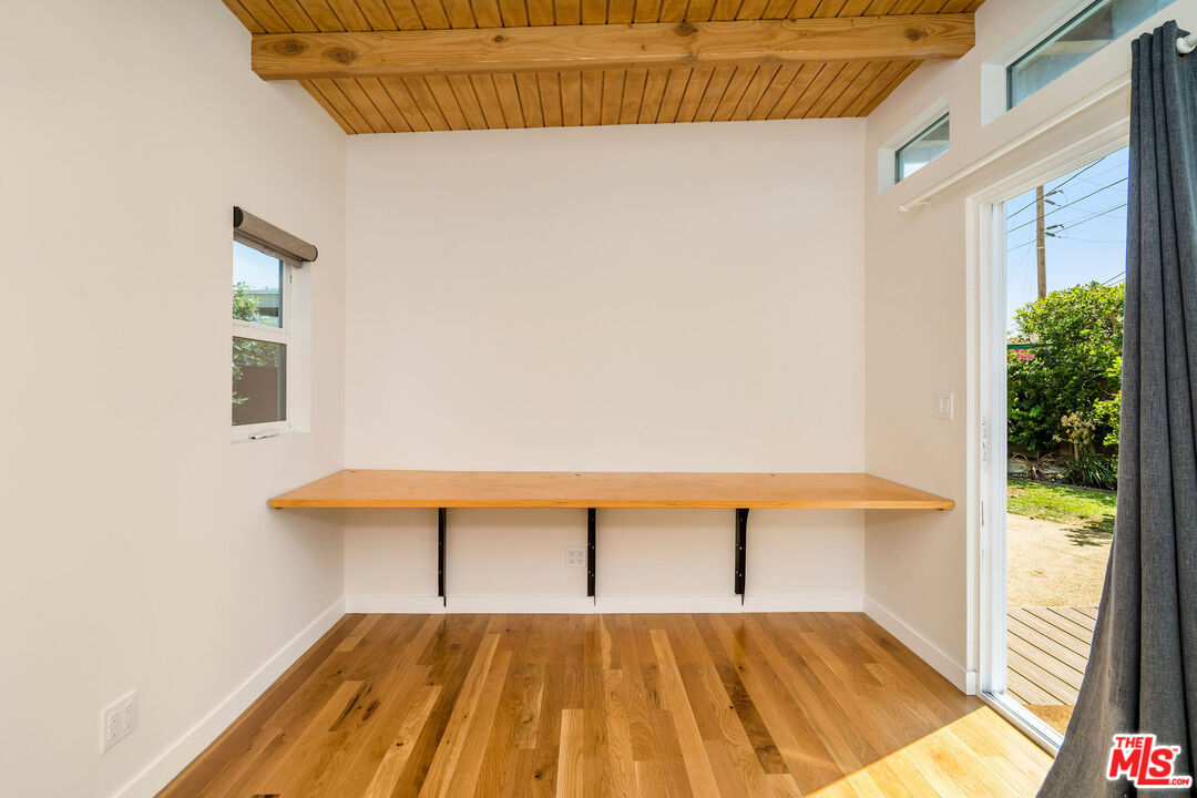 1215 North Avon Street Burbank, CA 91505 - Photo 31 of 37 a bedroom with a bed and a table