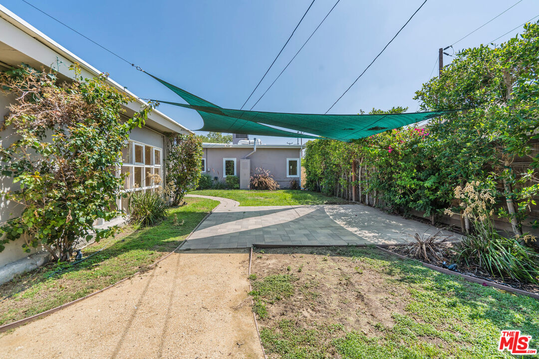 1215 North Avon Street Burbank, CA 91505 - Photo 34 of 37 a view of a house with a yard and sitting area