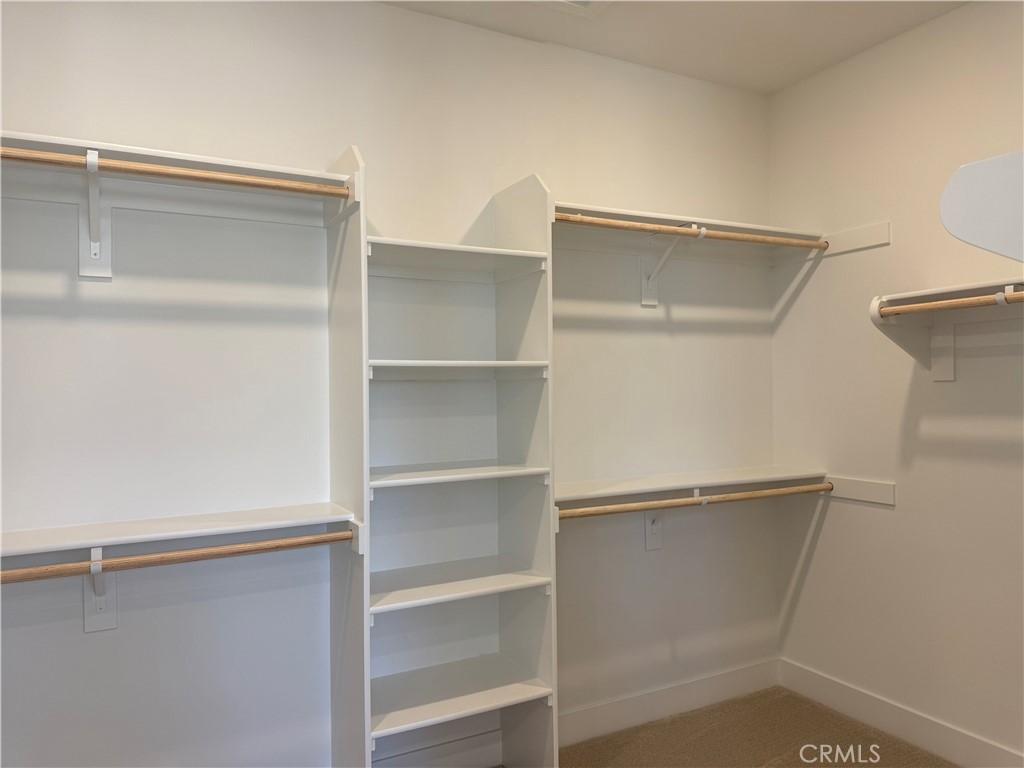 109 Trask Irvine, CA 92618 - Photo 14 of 25 a view of walk in closet with empty racks