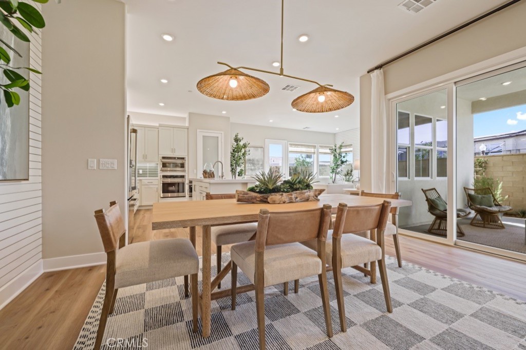109 Trask Irvine, CA 92618 - Photo 4 of 25 a dining area with a large window and table