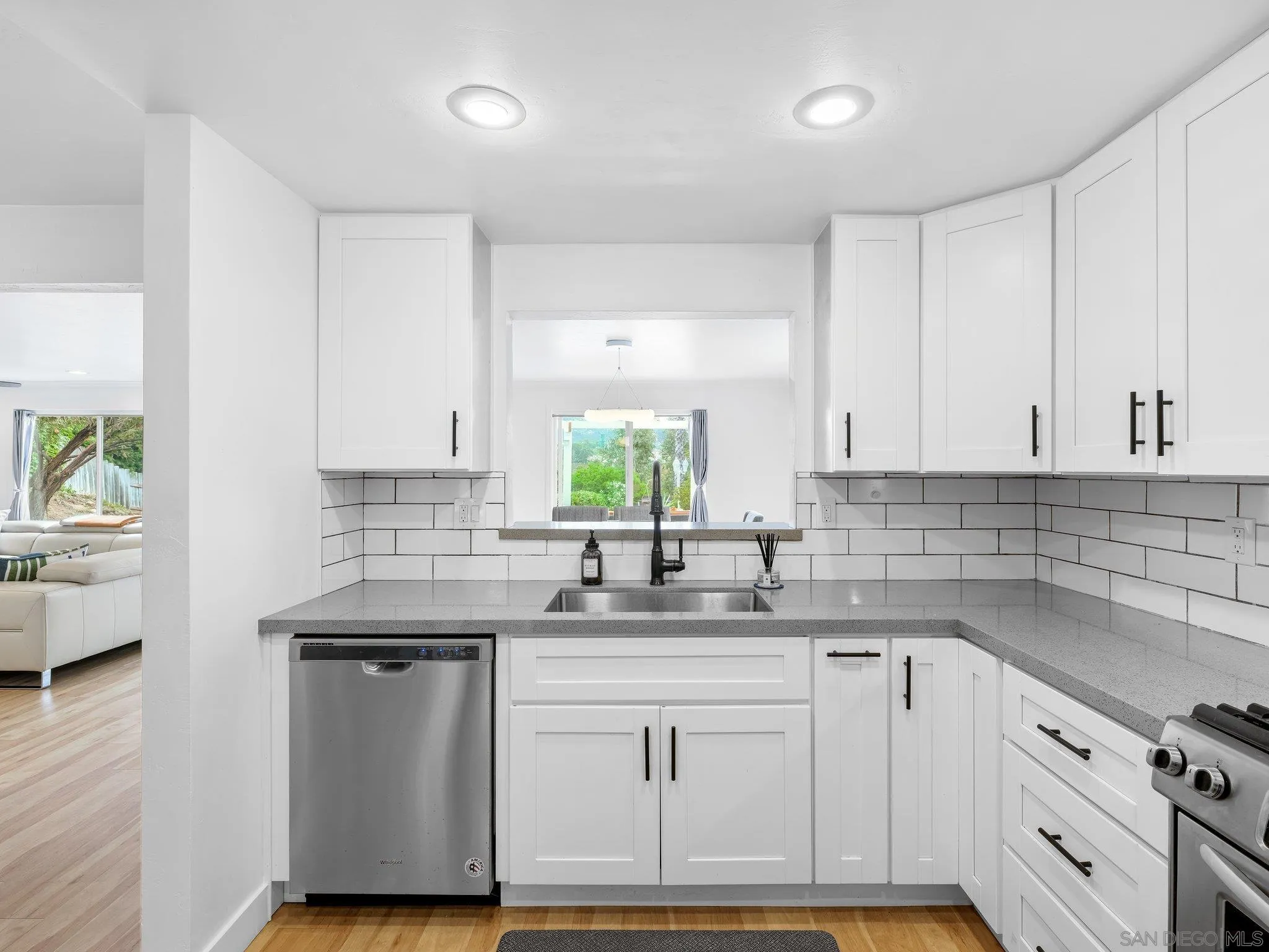 14813 Morningside Drive Poway, CA 92064 - Photo 11 of 37 a kitchen with sink cabinets and window