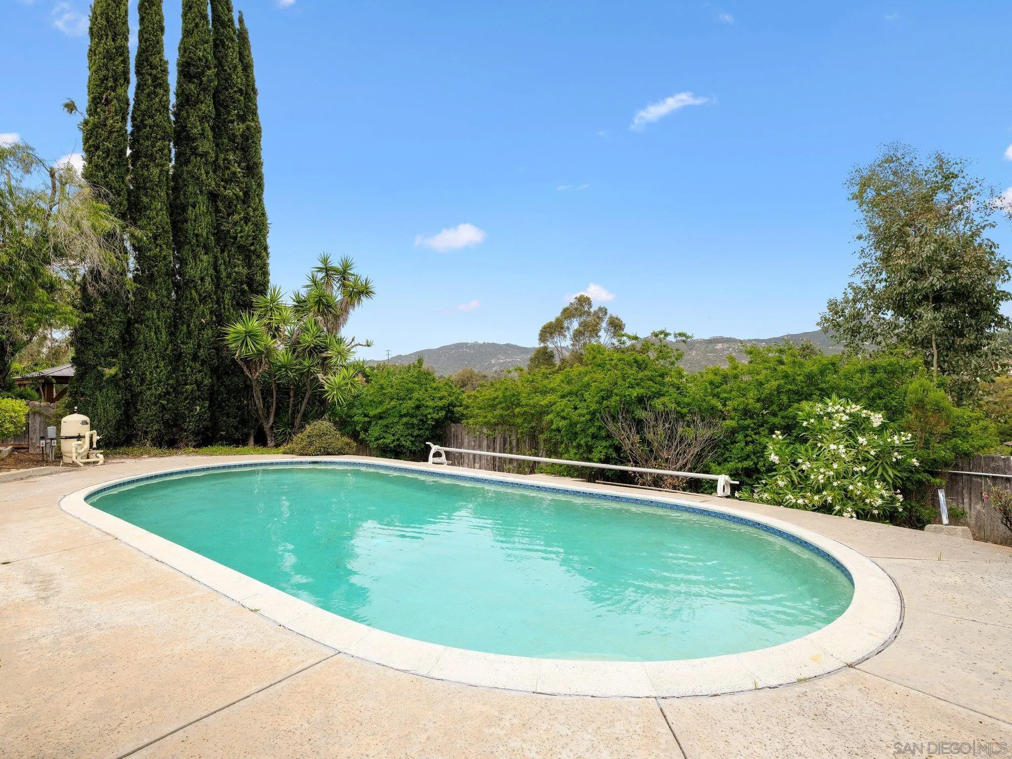 14813 Morningside Drive Poway, CA 92064 - Photo 20 of 37 a view of a swimming pool and trees in the background
