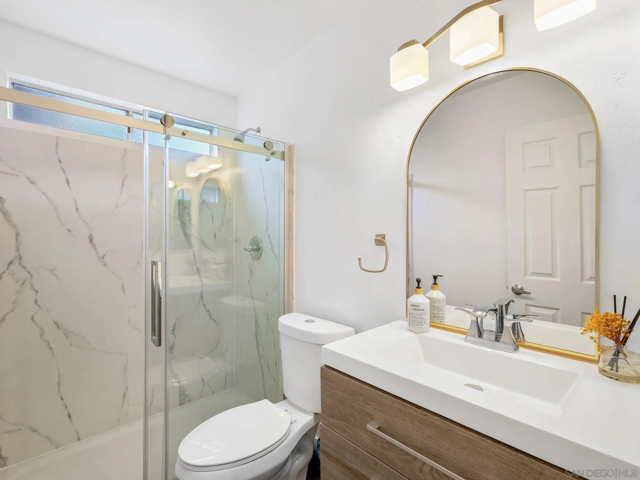 14813 Morningside Drive Poway, CA 92064 - Photo 24 of 37 a bathroom with a sink a toilet and shower