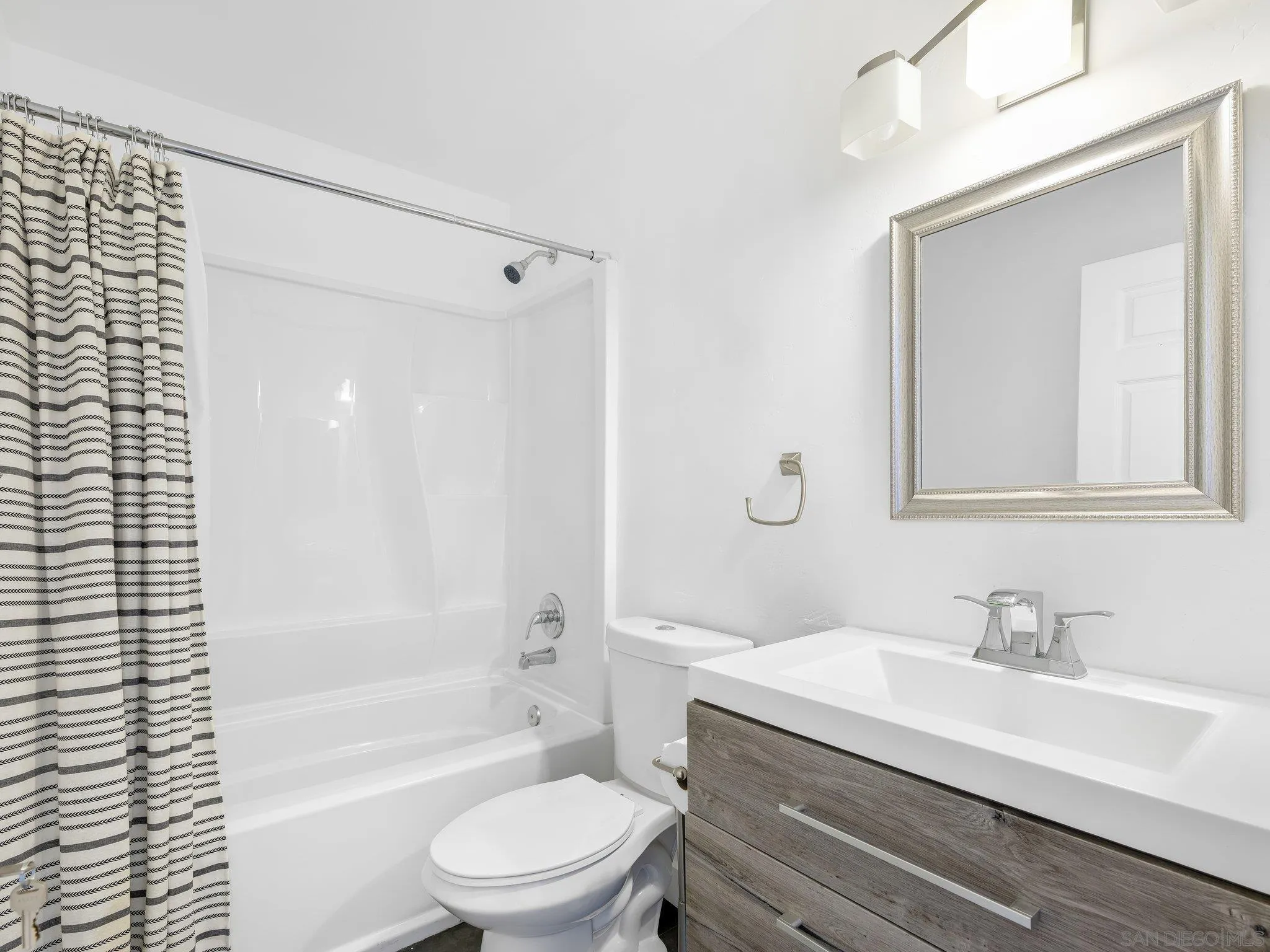 14813 Morningside Drive Poway, CA 92064 - Photo 31 of 37 a bathroom with a granite countertop sink toilet a mirror and shower