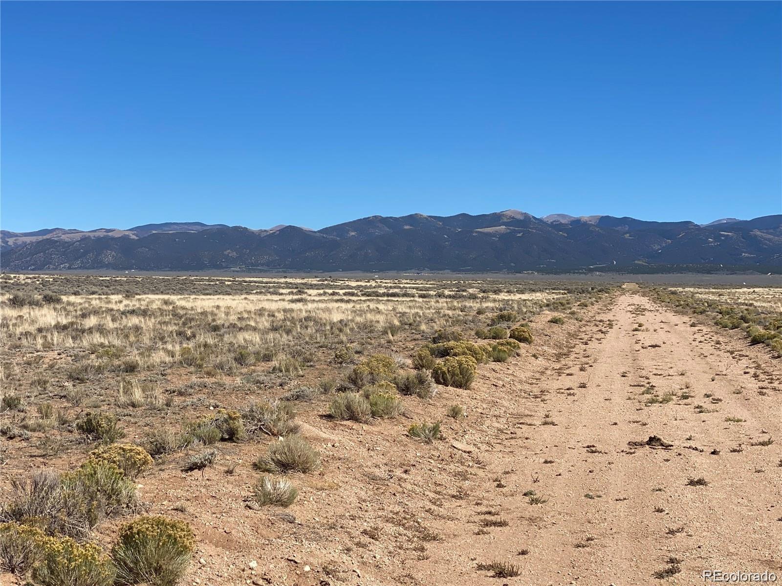 Apache Place San Luis, CO 81152 - Photo 2 of 7 a view of an lake with a mountain