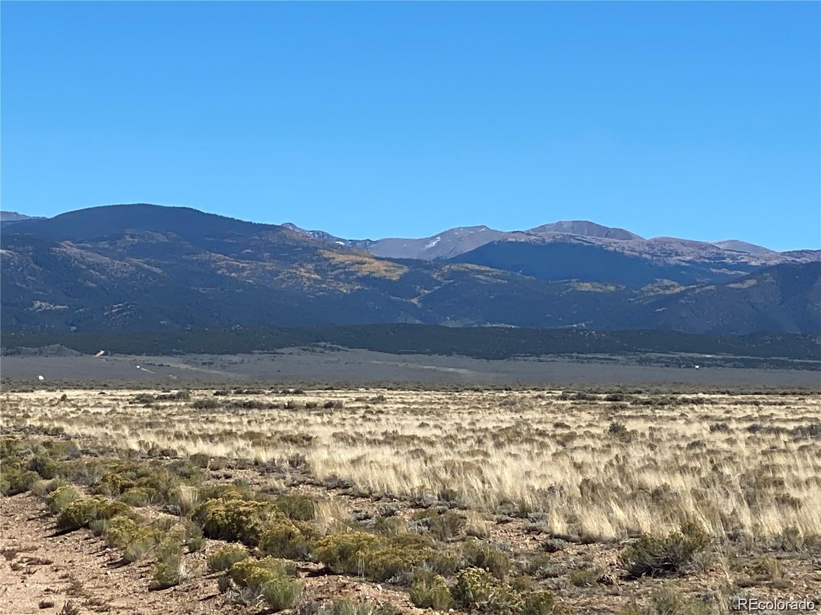 Apache Place San Luis, CO 81152 - Photo 3 of 7 a view of a large body of water with a building in the background