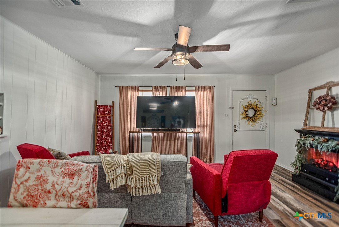 101 Lubbock Street Point Comfort, TX 77979 - Photo 13 of 34 a living room with furniture and a flat screen tv