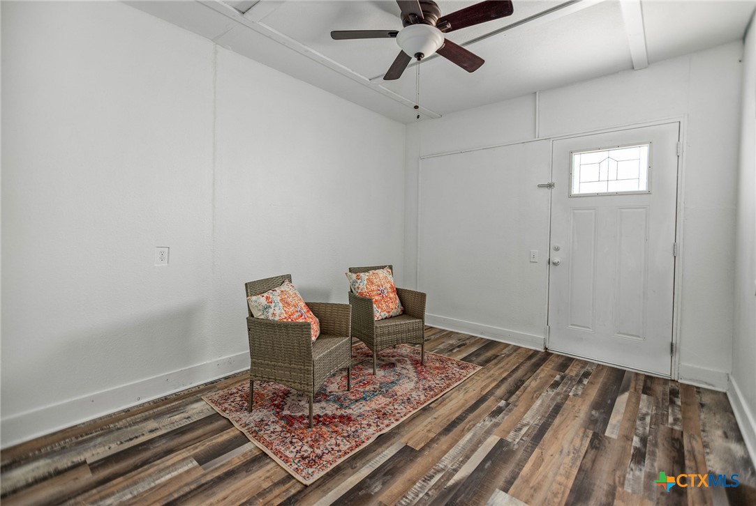 101 Lubbock Street Point Comfort, TX 77979 - Photo 15 of 34 a workspace room with wooden floor fan and windows