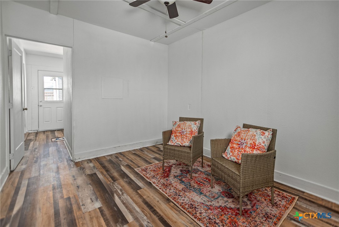 101 Lubbock Street Point Comfort, TX 77979 - Photo 16 of 34 a living room with furniture and a wooden floor