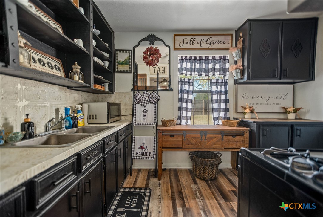 101 Lubbock Street Point Comfort, TX 77979 - Photo 20 of 34 a kitchen with stainless steel appliances granite countertop a stove and a sink