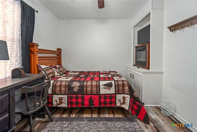 a bedroom with a bed and a table