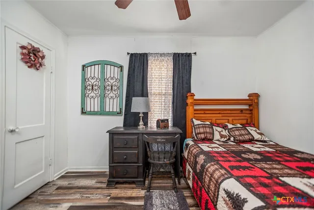 a bedroom with furniture and a window