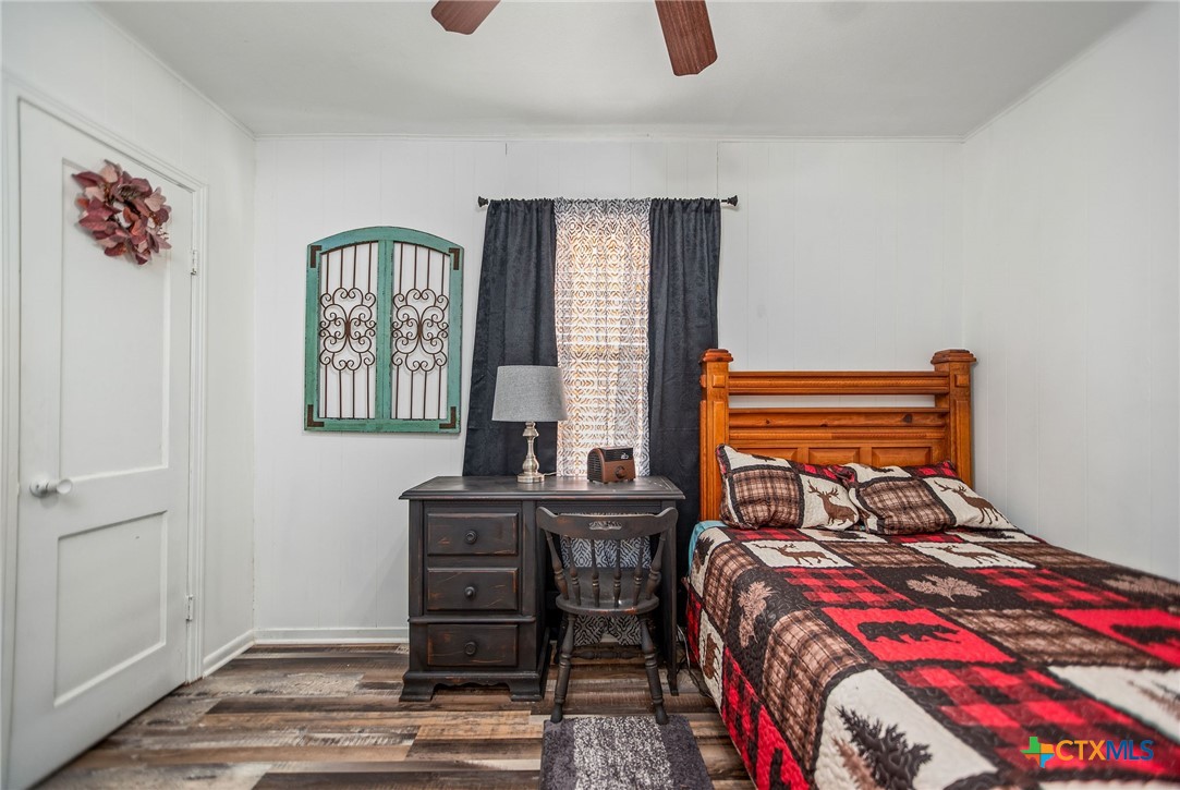 101 Lubbock Street Point Comfort, TX 77979 - Photo 26 of 34 a bedroom with a bed and a table